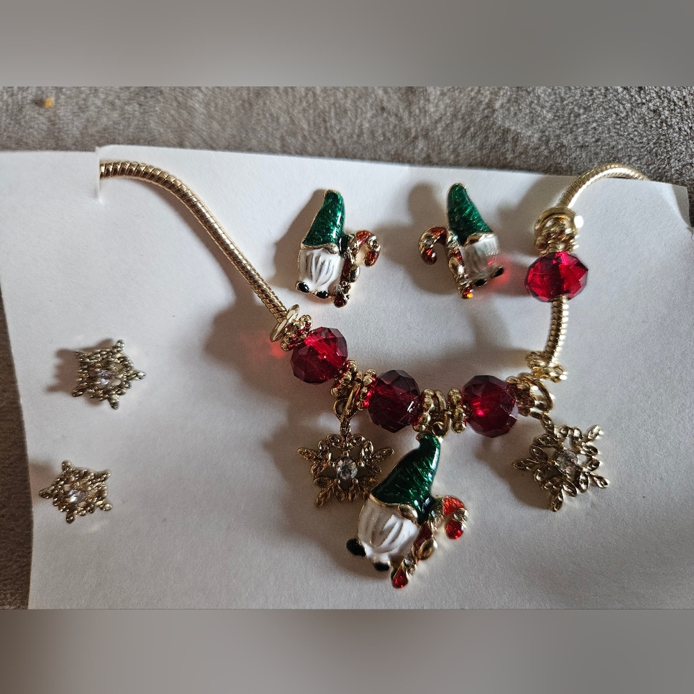 Gold tone gnome and snowflake necklace with matching earrings